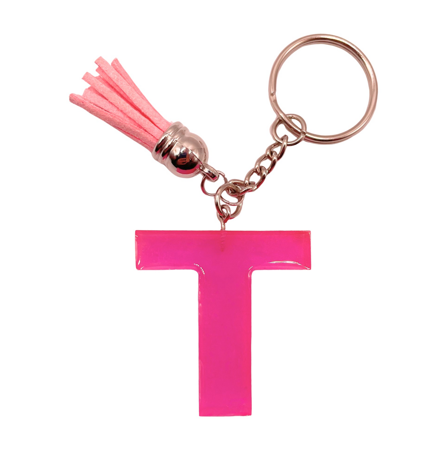 Pink letter 'T' keychain with a tassel on a white background