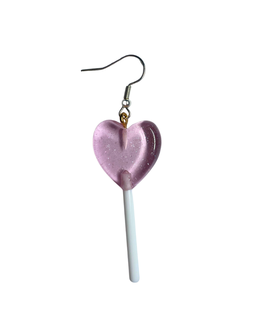 Heart-shaped lollipop earring on a white background